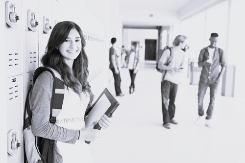 Female by lockers in school hallway 500×333 BW Female by lockers in school hallway