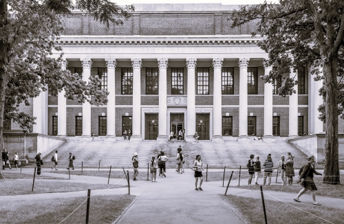 Students walking in front of college library